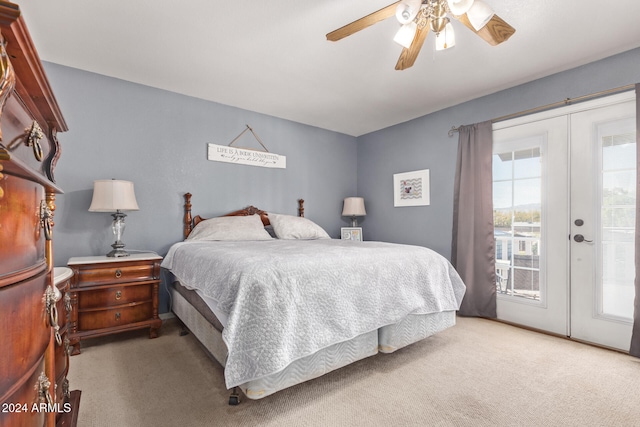 carpeted bedroom with french doors, access to outside, and multiple windows