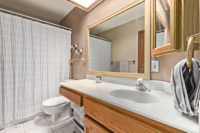 bathroom with vanity, toilet, and tile patterned floors