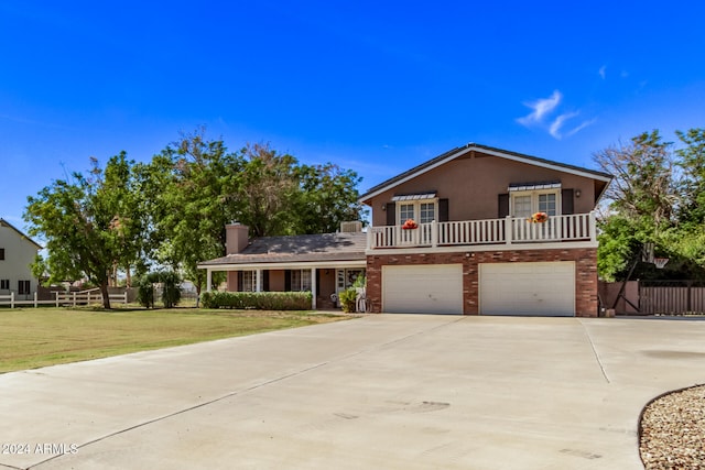 view of front of house with a front lawn and a garage