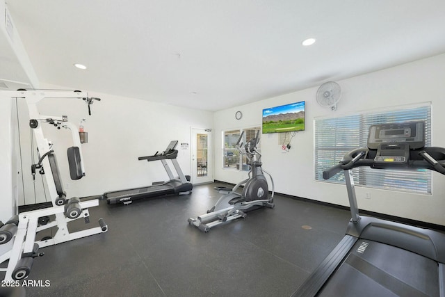 gym with baseboards and recessed lighting