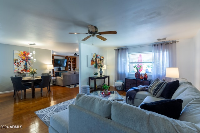 living room with ceiling fan and wood-type flooring