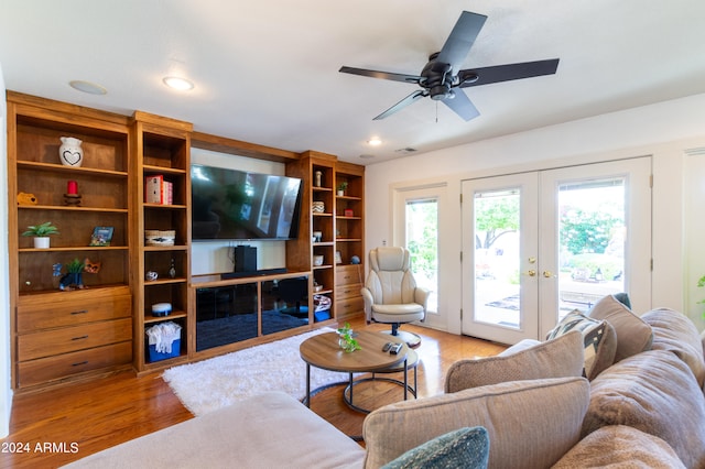 living room with french doors, hardwood / wood-style flooring, and ceiling fan