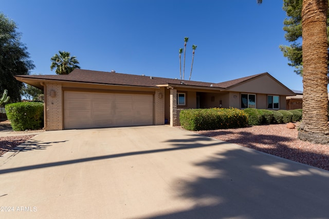 ranch-style house featuring a garage