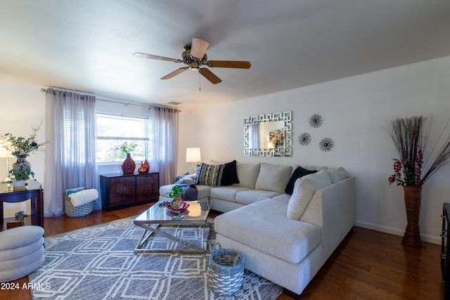 living room with ceiling fan and dark hardwood / wood-style flooring