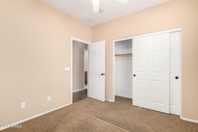 unfurnished bedroom featuring a closet, ceiling fan, and carpet floors