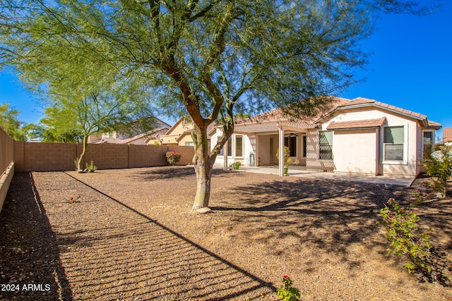 back of property with a patio area