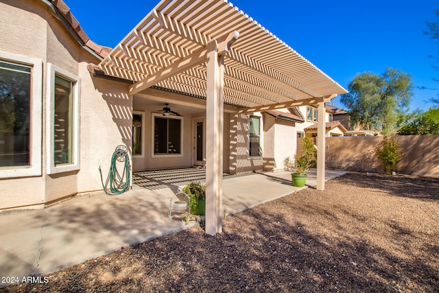 view of patio / terrace featuring a pergola and ceiling fan