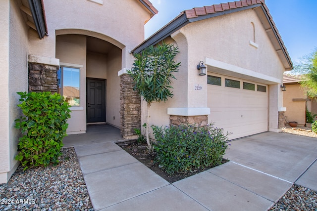 entrance to property featuring a garage