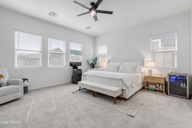 bedroom featuring ceiling fan and light carpet