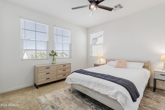 bedroom with ceiling fan and carpet flooring