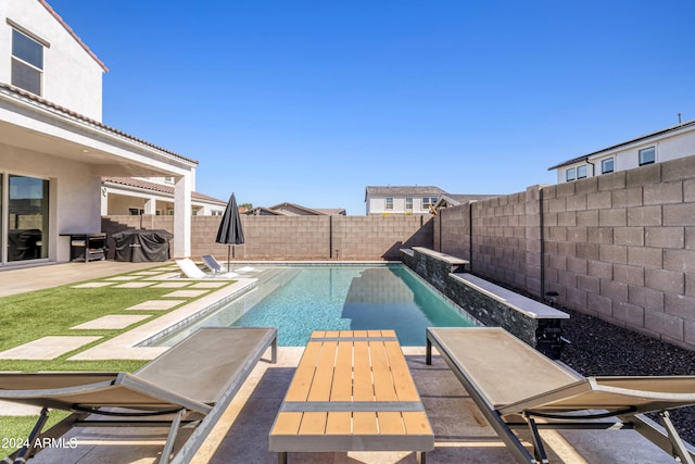 view of swimming pool featuring a patio