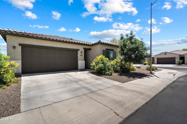 2753 E Fossil Ridge Rd, Phoenix, AZ 85050 - mediterranean / spanish-style house with stucco siding, an attached garage, driveway, and a tiled roof