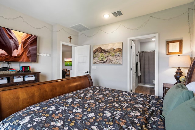 2753 E Fossil Ridge Rd, Phoenix, AZ 85050 - bedroom with wood finished floors and ensuite bath