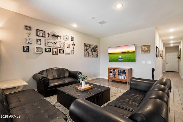 2753 E Fossil Ridge Rd, Phoenix, AZ 85050 - living area with light wood-style floors and recessed lighting