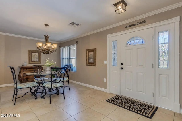 foyer featuring a healthy amount of sunlight, visible vents, and ornamental molding