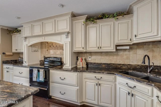 kitchen featuring a sink, backsplash, custom exhaust hood, and black electric range oven