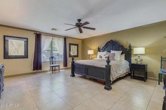 bedroom with light tile patterned flooring, baseboards, visible vents, and ornamental molding