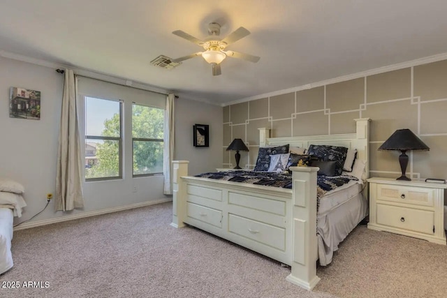 bedroom featuring light colored carpet, crown molding, and ceiling fan