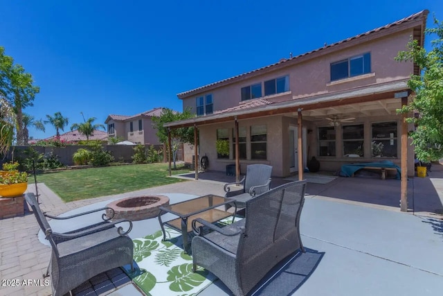 view of patio / terrace featuring an outdoor fire pit and fence