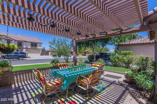 view of patio featuring outdoor dining space and a pergola