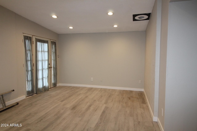 spare room with light hardwood / wood-style floors