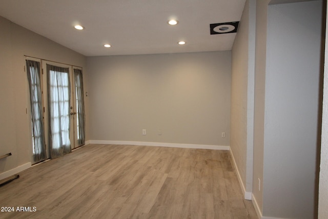 unfurnished room with light wood-type flooring