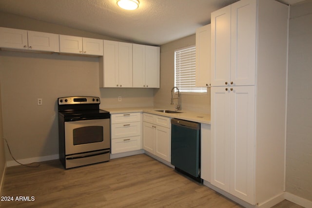 kitchen with sink, dishwasher, electric range oven, light hardwood / wood-style floors, and white cabinets