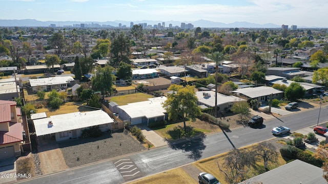 birds eye view of property featuring a mountain view