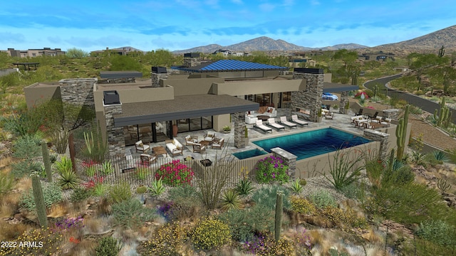 view of swimming pool with a mountain view and a patio