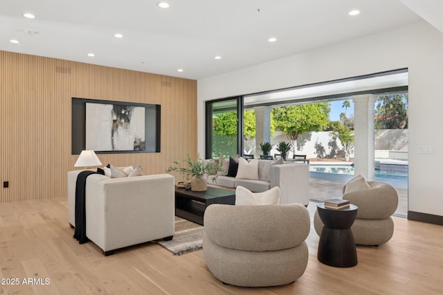 living area featuring recessed lighting and light wood-style floors