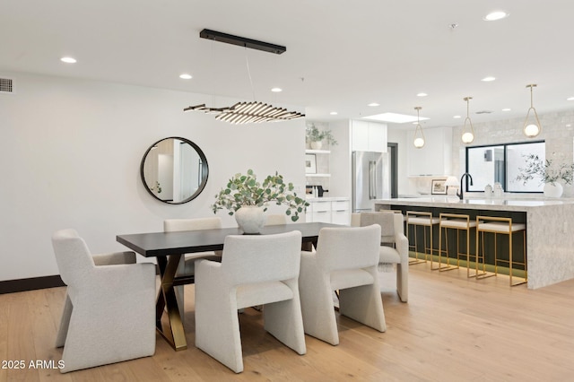 dining area with recessed lighting, visible vents, and light wood-style flooring