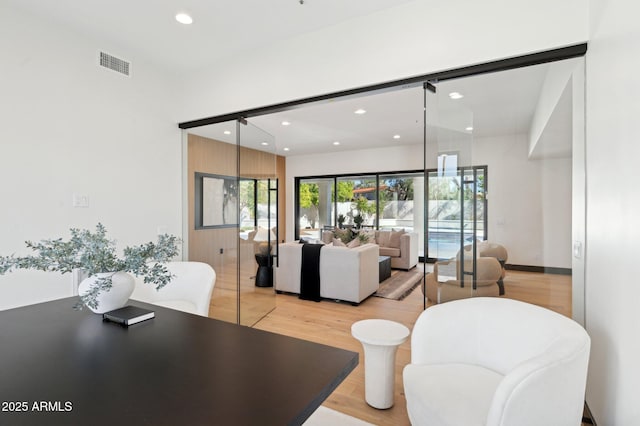 interior space with light wood-style flooring, recessed lighting, and visible vents
