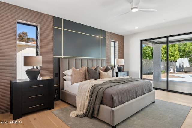 bedroom featuring recessed lighting, light wood-style flooring, a ceiling fan, and access to outside