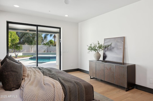 bedroom featuring recessed lighting, baseboards, light wood-style floors, and access to outside