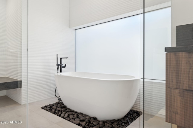 full bath featuring a freestanding bath