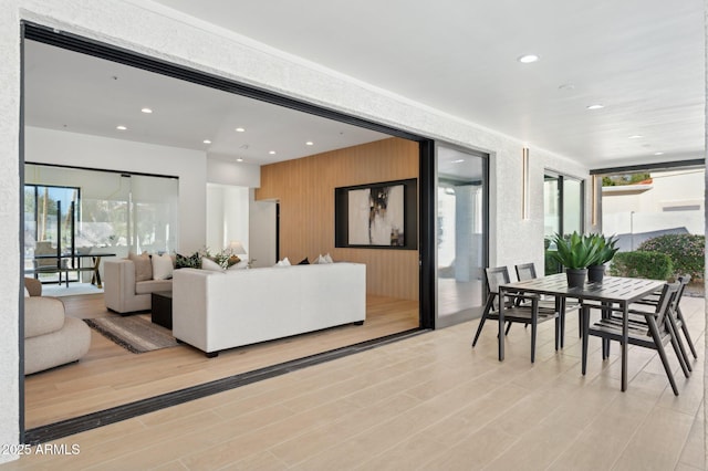 living room with recessed lighting and light wood-style floors