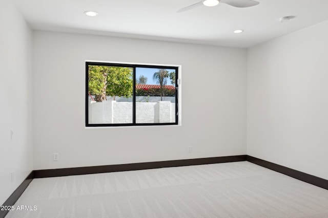 unfurnished room with a ceiling fan, recessed lighting, carpet, and baseboards
