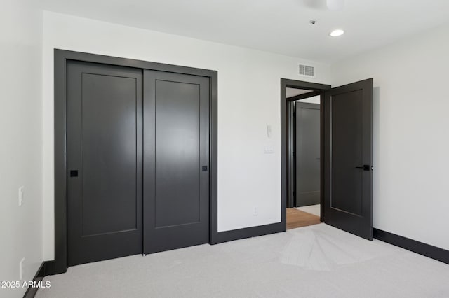 bedroom featuring visible vents, baseboards, recessed lighting, a closet, and carpet flooring