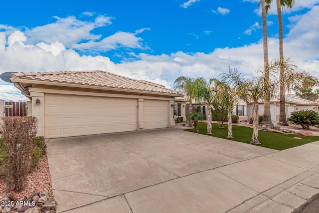 view of front facade with a tile roof, concrete driveway, and stucco siding