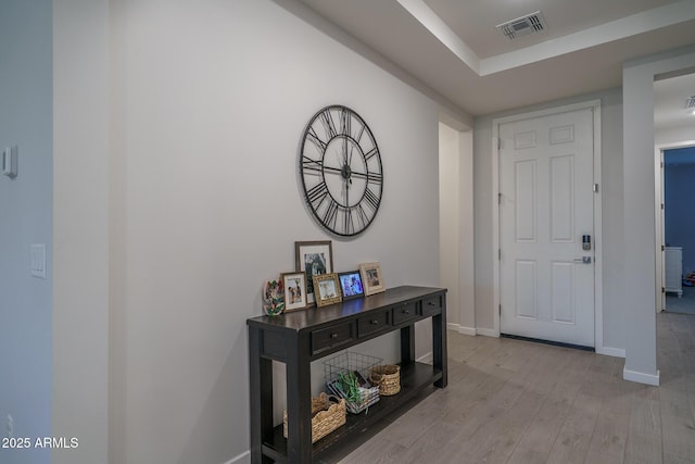 8513 N 172nd Ln, Waddell, AZ 85355 - interior space featuring light wood-style floors, visible vents, and baseboards