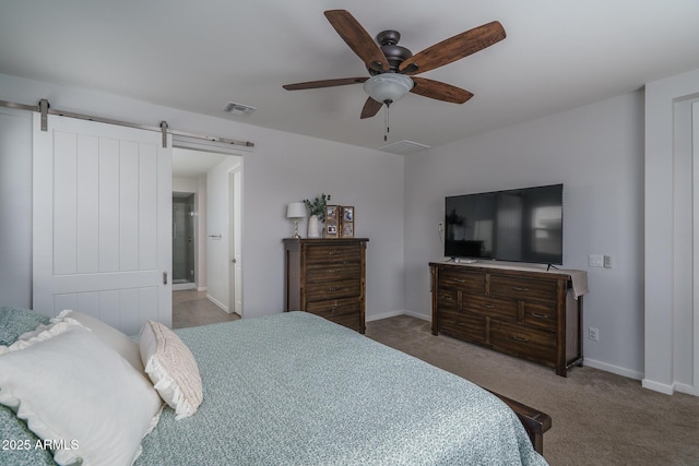 8513 N 172nd Ln, Waddell, AZ 85355 - bedroom featuring ceiling fan, visible vents, a barn door, carpet floors, and baseboards