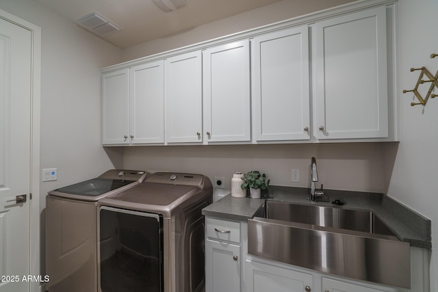 8513 N 172nd Ln, Waddell, AZ 85355 - clothes washing area featuring washing machine and clothes dryer, a sink, cabinet space, and visible vents