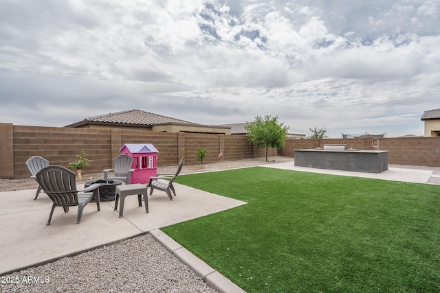 8513 N 172nd Ln, Waddell, AZ 85355 - view of yard with a patio, a fenced backyard, and an outdoor fire pit