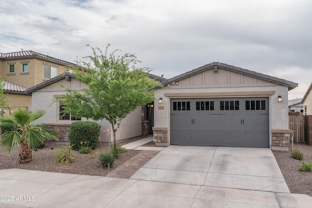 8513 N 172nd Ln, Waddell, AZ 85355 - view of front of home featuring driveway, stucco siding, and stone siding