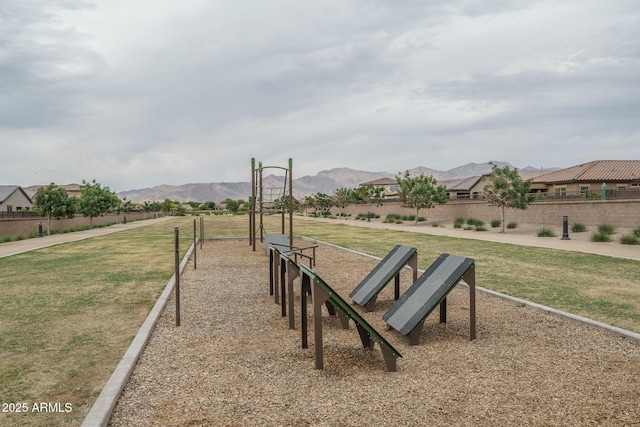 8513 N 172nd Ln, Waddell, AZ 85355 - surrounding community with a mountain view, fence, playground community, and a lawn