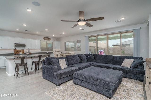 8513 N 172nd Ln, Waddell, AZ 85355 - living area featuring light wood-style floors, recessed lighting, visible vents, and ceiling fan