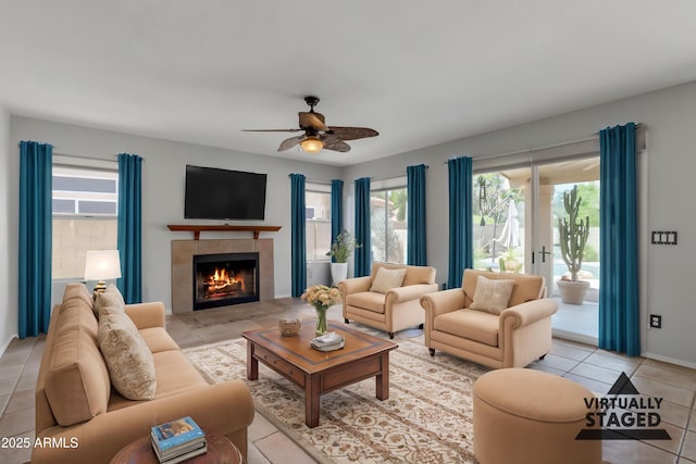 2340 W Myrtle Dr, Chandler, AZ 85248 - living area with plenty of natural light, a ceiling fan, light tile patterned floors, and a tile fireplace