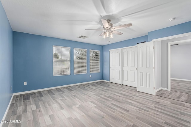 10440 E Osage Ave, Mesa, AZ 85212 - unfurnished bedroom featuring baseboards, light wood-style flooring, a closet, and ceiling fan