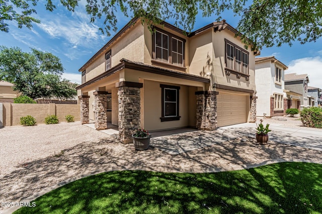 10440 E Osage Ave, Mesa, AZ 85212 - view of front of property featuring stone siding, stucco siding, an attached garage, and driveway