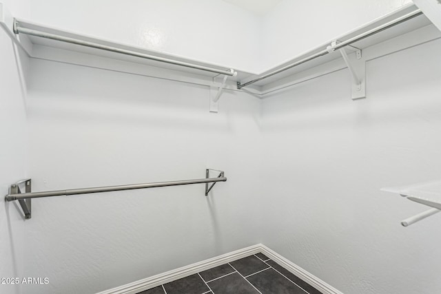 10440 E Osage Ave, Mesa, AZ 85212 - walk in closet featuring dark tile patterned floors